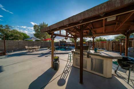 Hardscaping backyard grill and pool